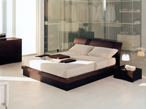 Coil: Serene yet stylish double bed dark colored oak wood.